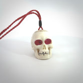 These are handmade skull pendants carved from deer antler with Synthetic Ruby Red Corundum. A fantastic piece if you like skulls and would like a medium sized piece. The cord is adjustable so you can wear this where it suits you best. We ship these free worldwide.